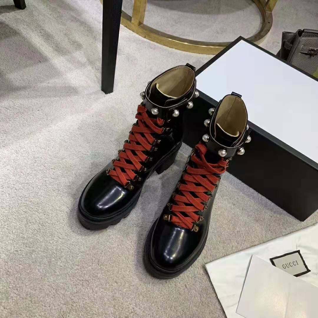 G*u*i women leather ankle boot with red laces in black shiny leather