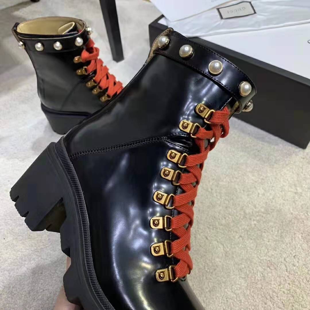 G*u*i women leather ankle boot with red laces in black shiny leather