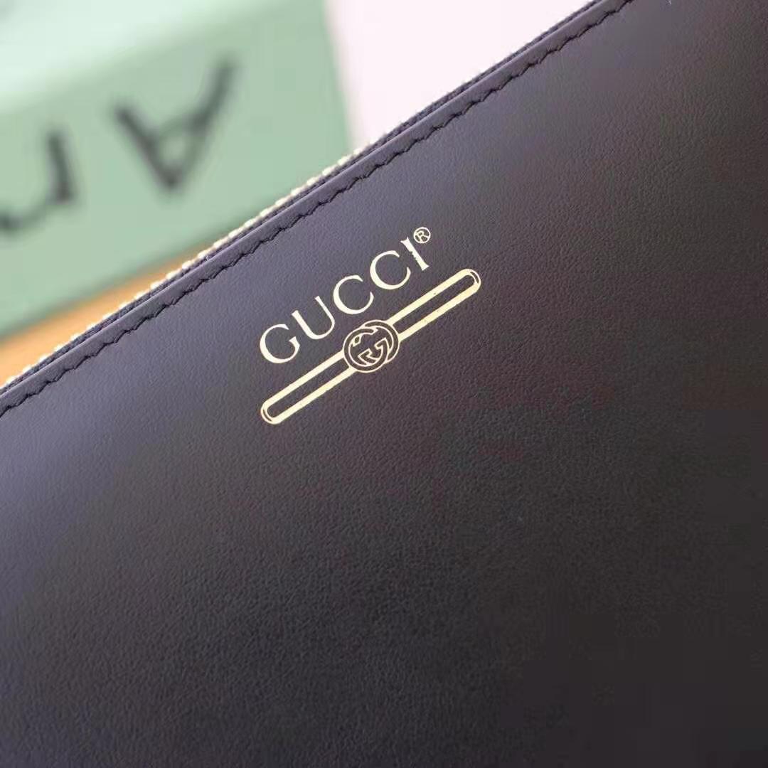 G*u*i gg unisex leather zip around wallet with G*u*i logo in black leather