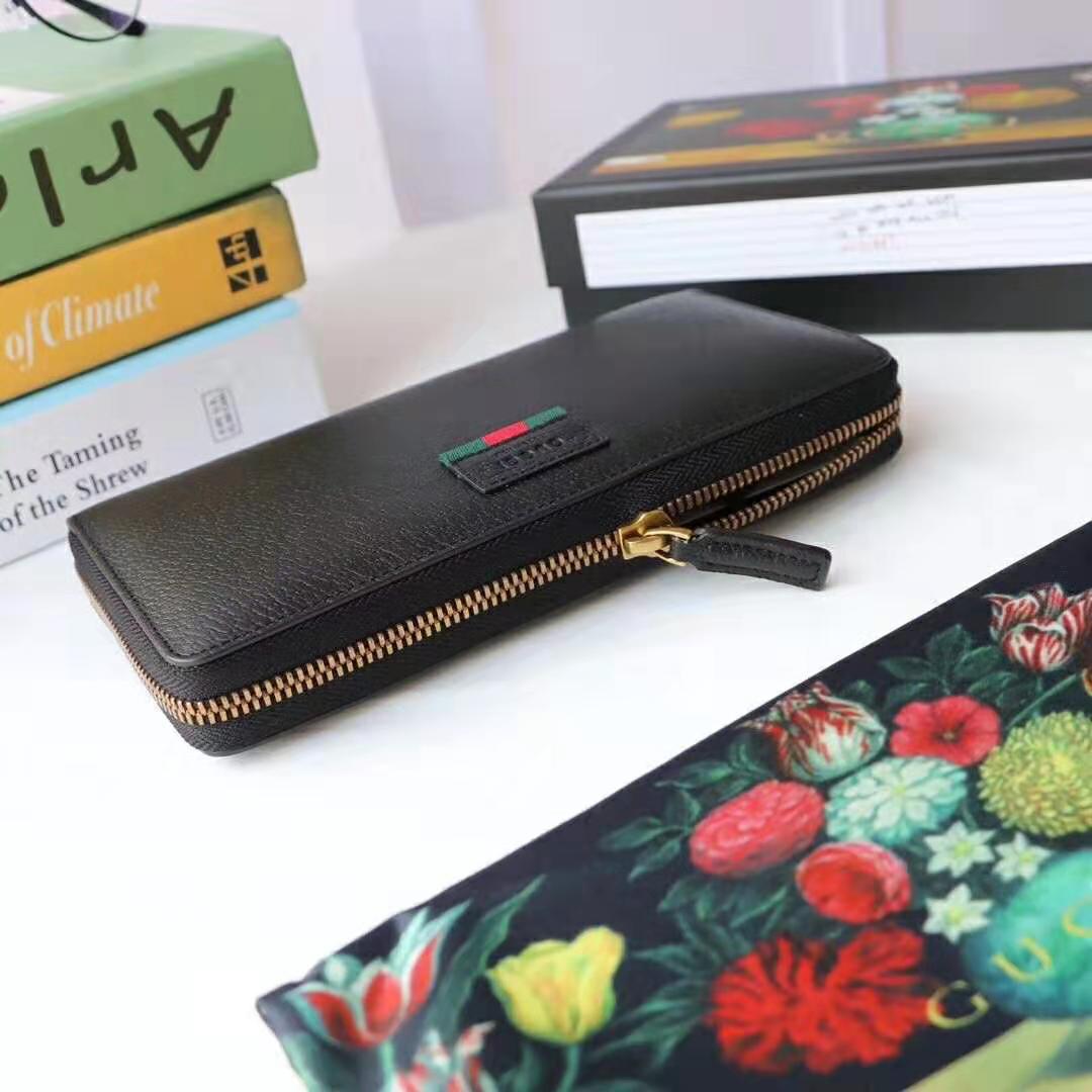G*u*i gg unisex leather zip around wallet with web in black leather